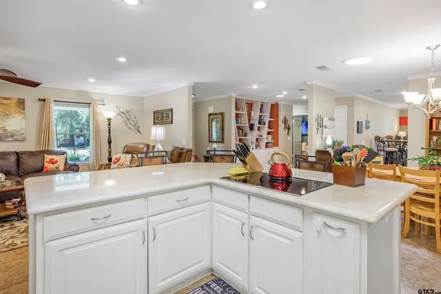 a group of people sitting in a kitchen