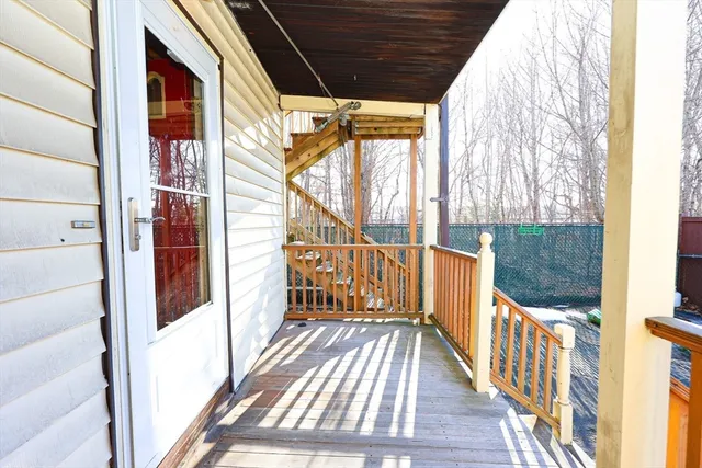a view of balcony with wooden floor