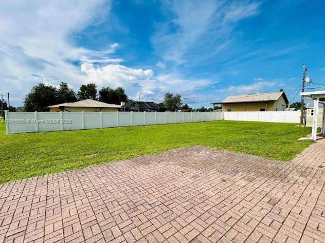 3147 Trevino Terrace, Unit 2 Punta Gorda, FL 33983 - Photo 13 of 24 a view of a backyard with a garden
