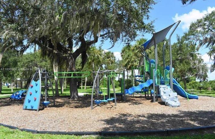 3147 Trevino Terrace, Unit 2 Punta Gorda, FL 33983 - Photo 17 of 24 a view of a park with large trees