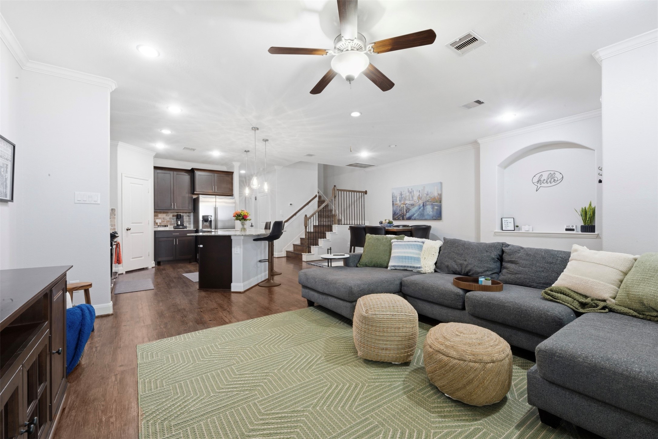 706 Water Street Webster, TX 77598 - Photo 11 of 23 Light-filled and open, the living area is designed for effortless evenings or casual hosting.