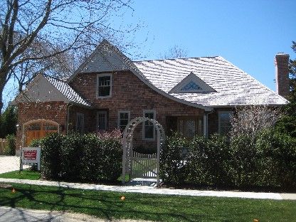 45 Sherrill Road East Hampton, NY 11937 - Photo 1 of 22 a front view of a house with a garden