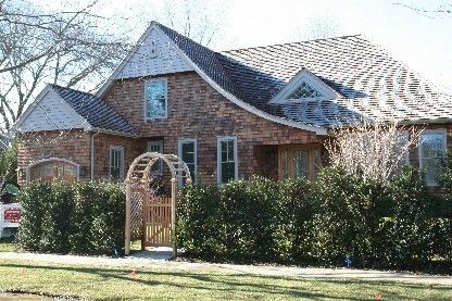 45 Sherrill Road East Hampton, NY 11937 - Photo 2 of 22 a front view of a house with a garden