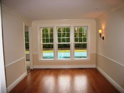 45 Sherrill Road East Hampton, NY 11937 - Photo 5 of 22 a view of an empty room with wooden floor and a window