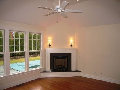 45 Sherrill Road East Hampton, NY 11937 - Photo 8 of 22 a view of an empty room with exposed radiator and fireplace