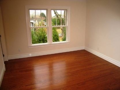 45 Sherrill Road East Hampton, NY 11937 - Photo 9 of 22 an empty room with wooden floor and windows
