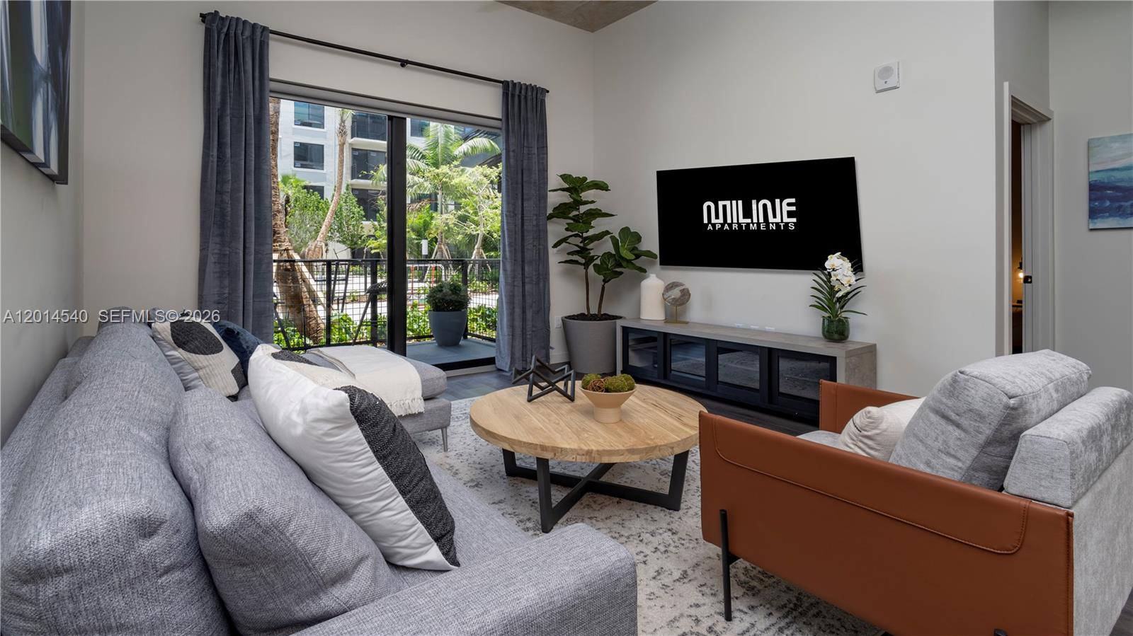 6970 Southwest 40th Street, Unit 224 Miami, FL 33155 - Photo 16 of 20 a living room with furniture and a large window