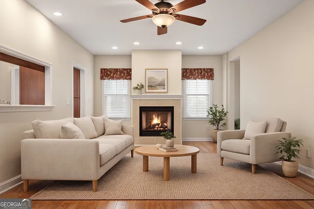 a living room with furniture and a fireplace