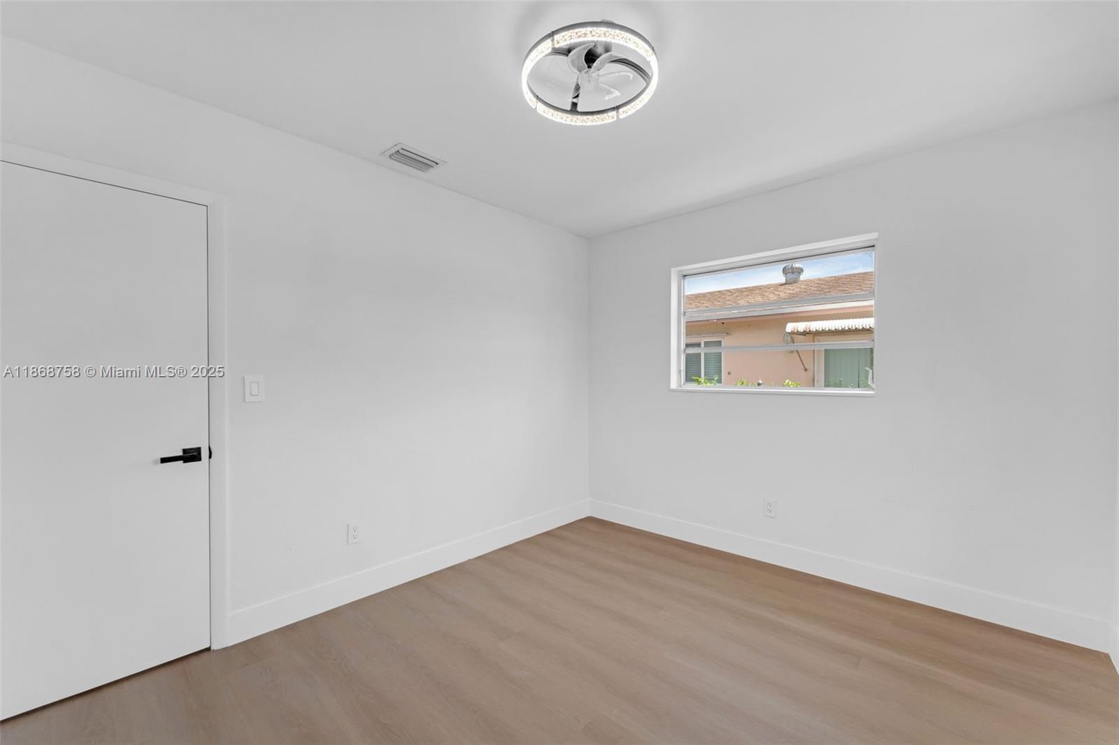 11711 Southwest 181st Terrace Miami, FL 33177 - Photo 17 of 35 a view of a room with wooden floor