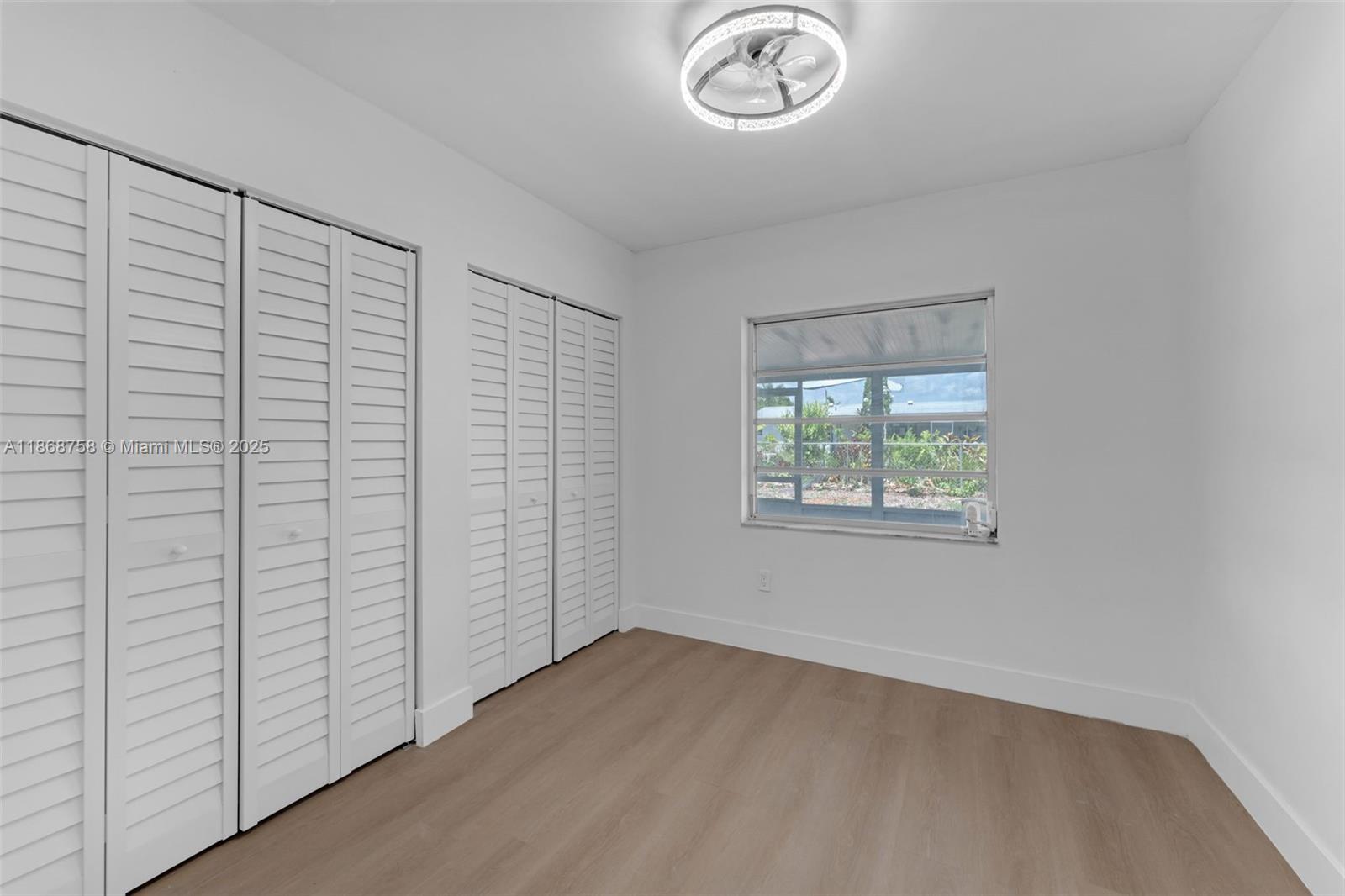 11711 Southwest 181st Terrace Miami, FL 33177 - Photo 21 of 35 an empty room with a window