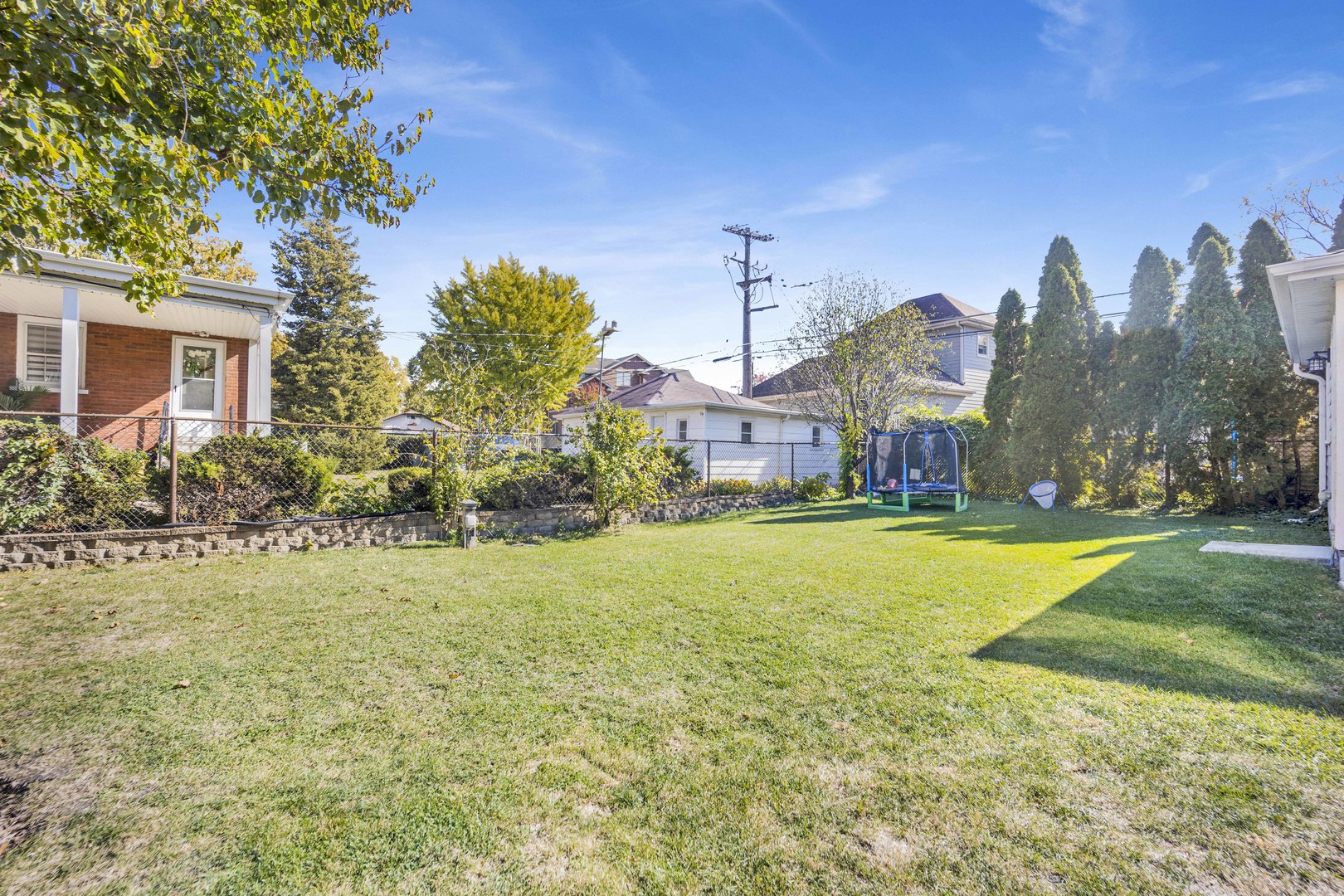 261 Herrick Road Riverside, IL 60546 - Photo 29 of 32 a front view of a house with a yard and fountain