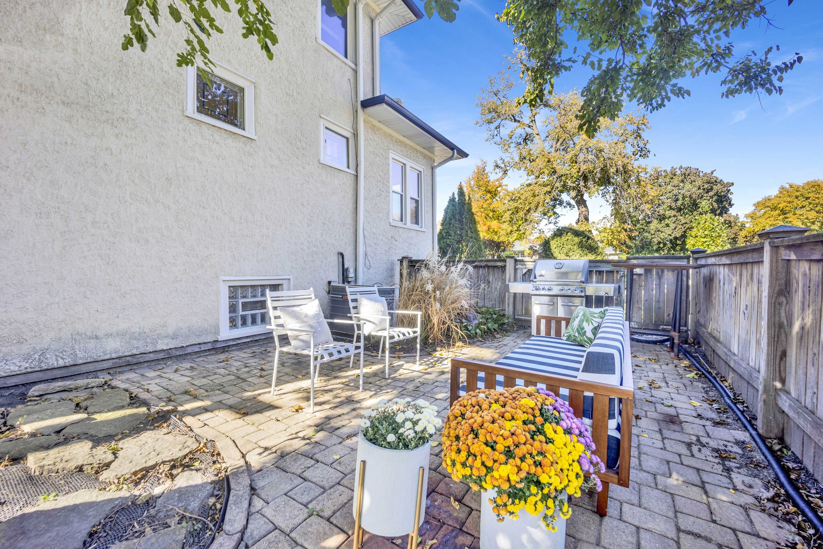 261 Herrick Road Riverside, IL 60546 - Photo 30 of 32 a view of a patio with table and chairs and potted plants