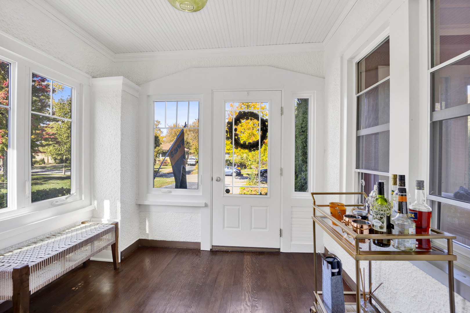 261 Herrick Road Riverside, IL 60546 - Photo 3 of 32 a view of an entryway with wooden floor and windows
