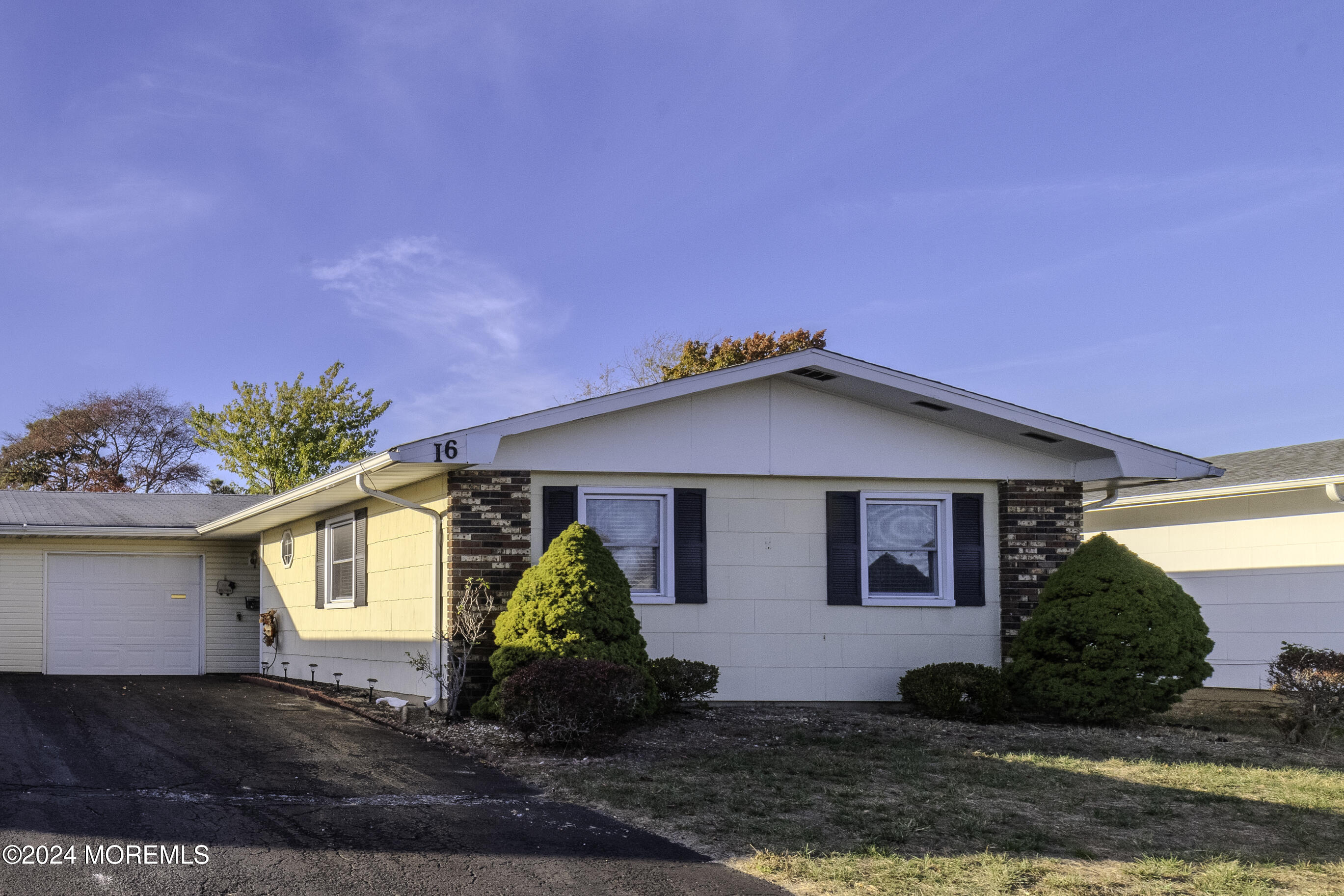 16 Lamb Road Brick, NJ 08724 - Photo 1 of 23 a front view of a house with a yard