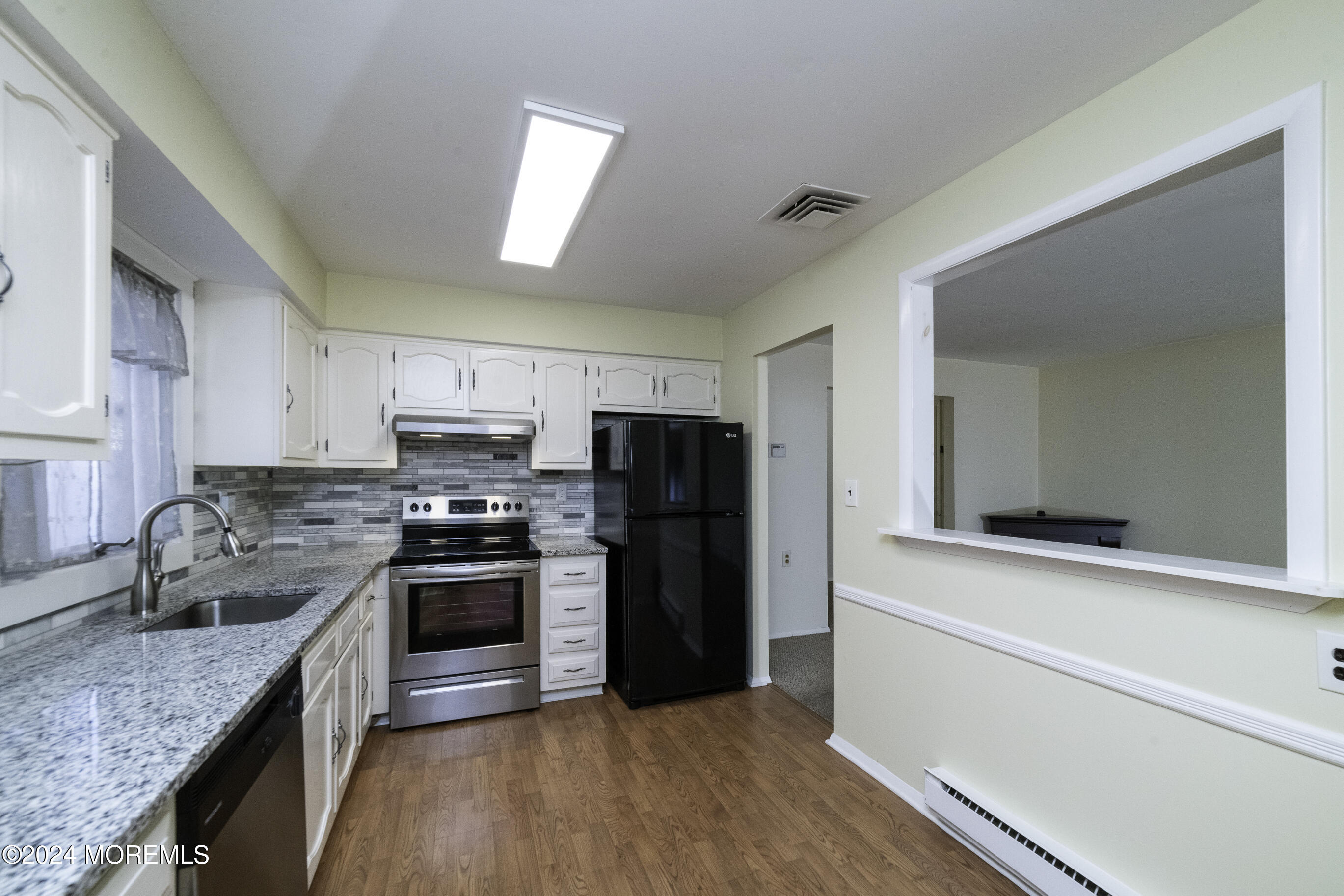 16 Lamb Road Brick, NJ 08724 - Photo 11 of 23 a kitchen with stainless steel appliances granite countertop a sink stove and refrigerator