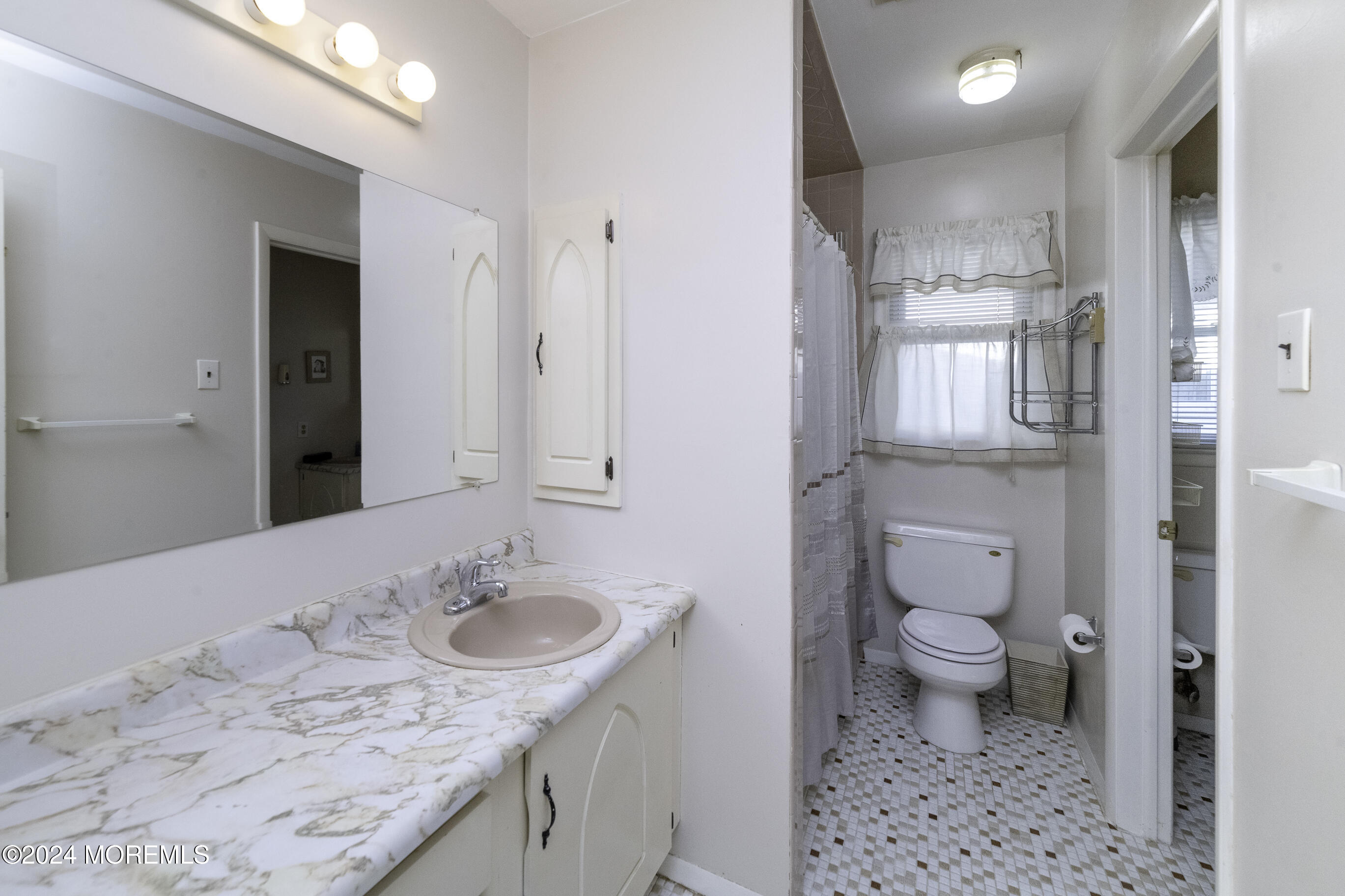 16 Lamb Road Brick, NJ 08724 - Photo 14 of 23 a bathroom with a granite countertop sink a toilet a mirror and shower