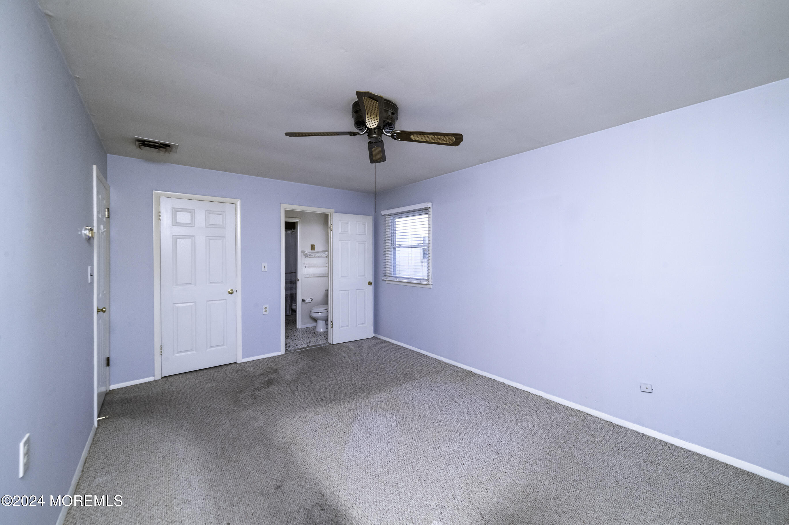 16 Lamb Road Brick, NJ 08724 - Photo 15 of 23 a view of a livingroom with a ceiling fan and window