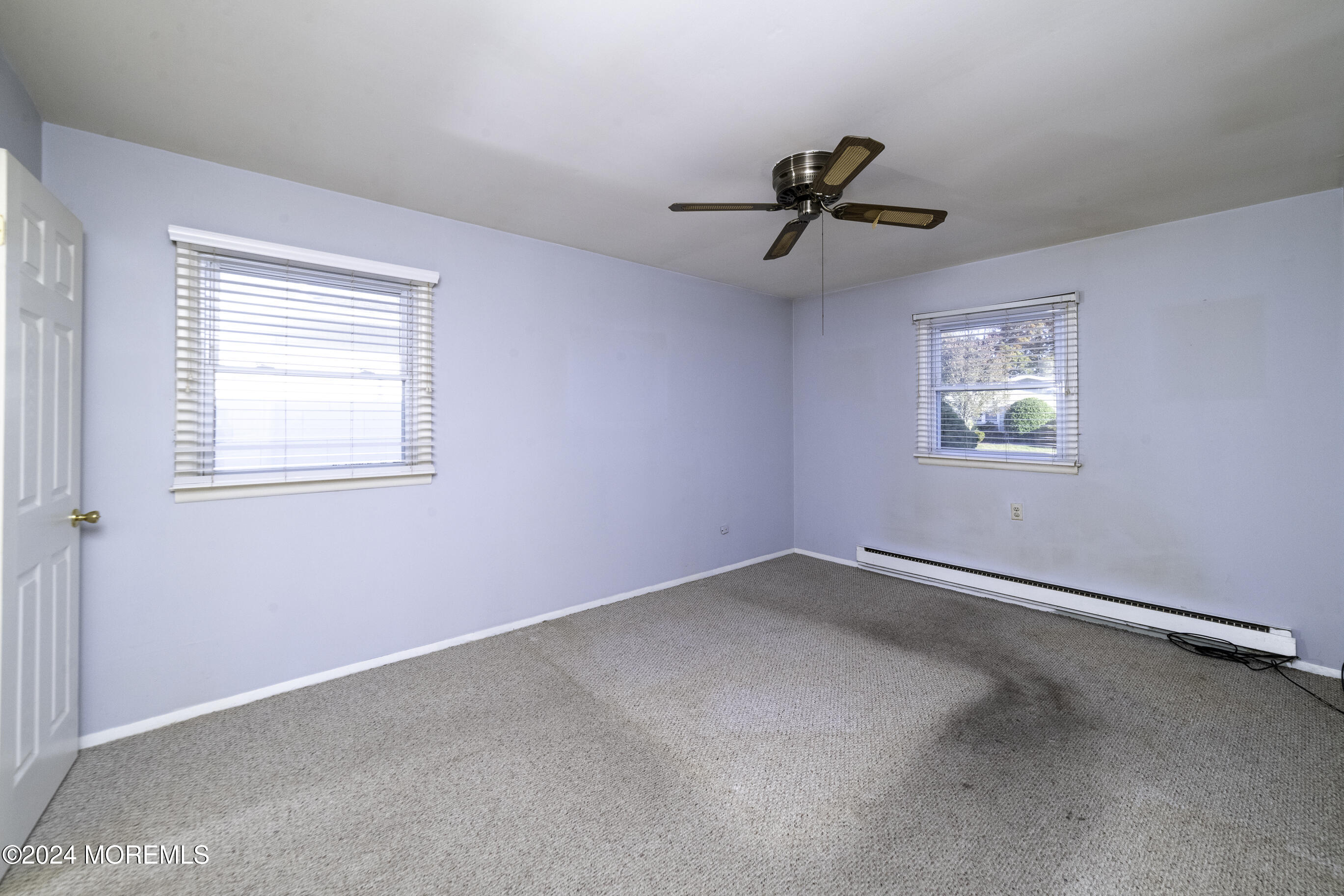 16 Lamb Road Brick, NJ 08724 - Photo 17 of 23 an empty room with windows and fan