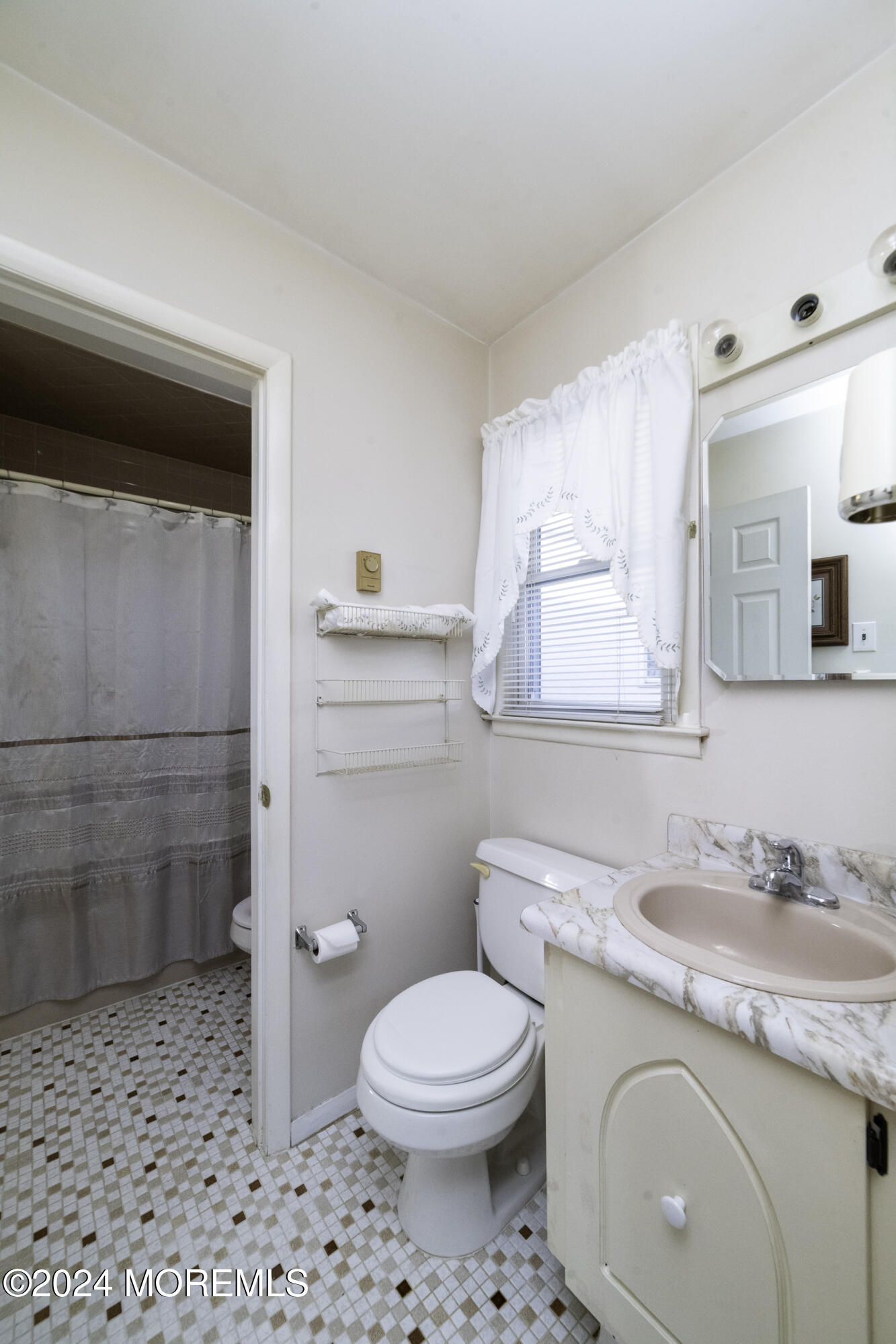 16 Lamb Road Brick, NJ 08724 - Photo 19 of 23 a bathroom with a granite countertop toilet a sink and a mirror