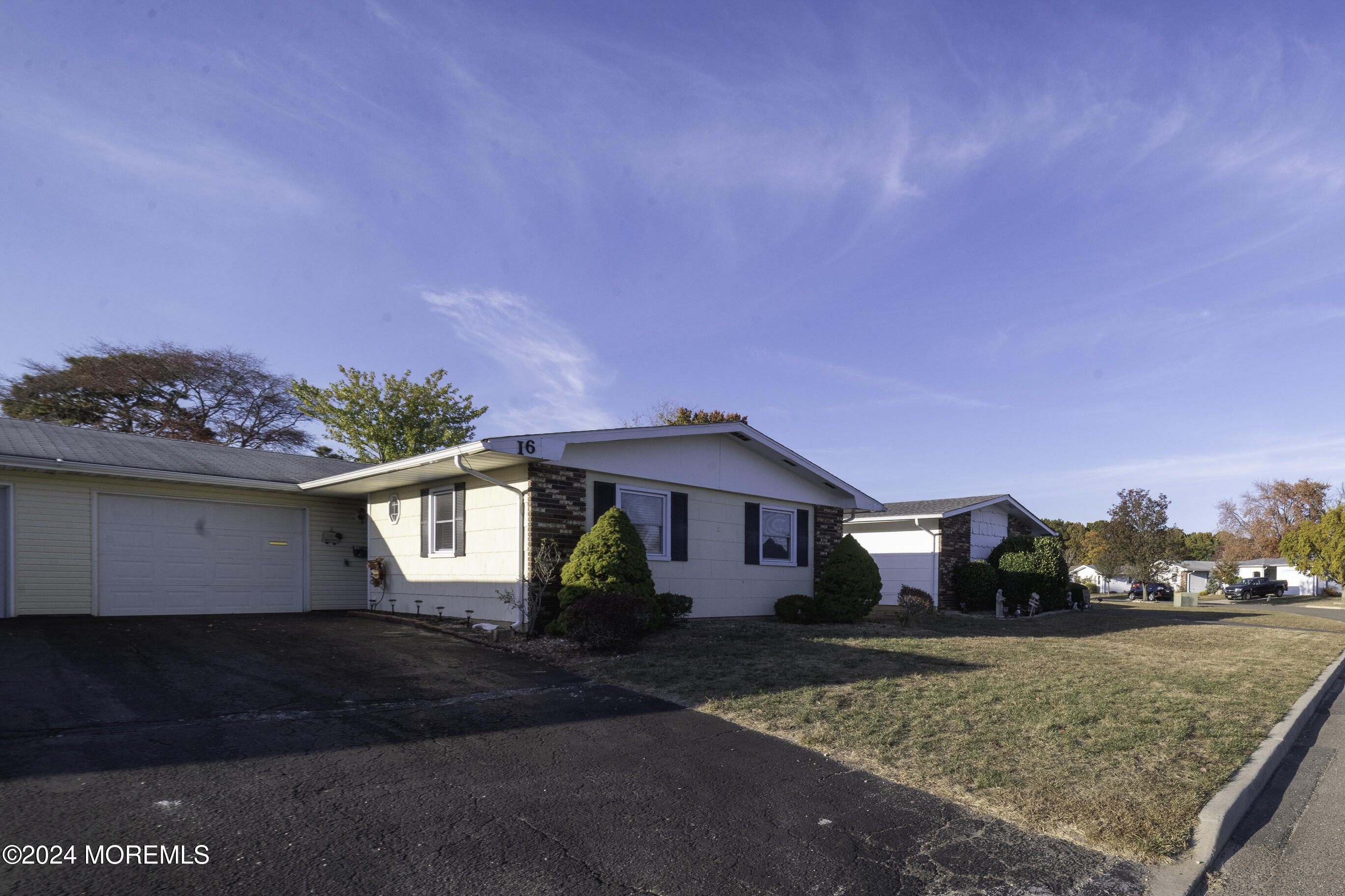 16 Lamb Road Brick, NJ 08724 - Photo 2 of 23 a front view of a house with a yard