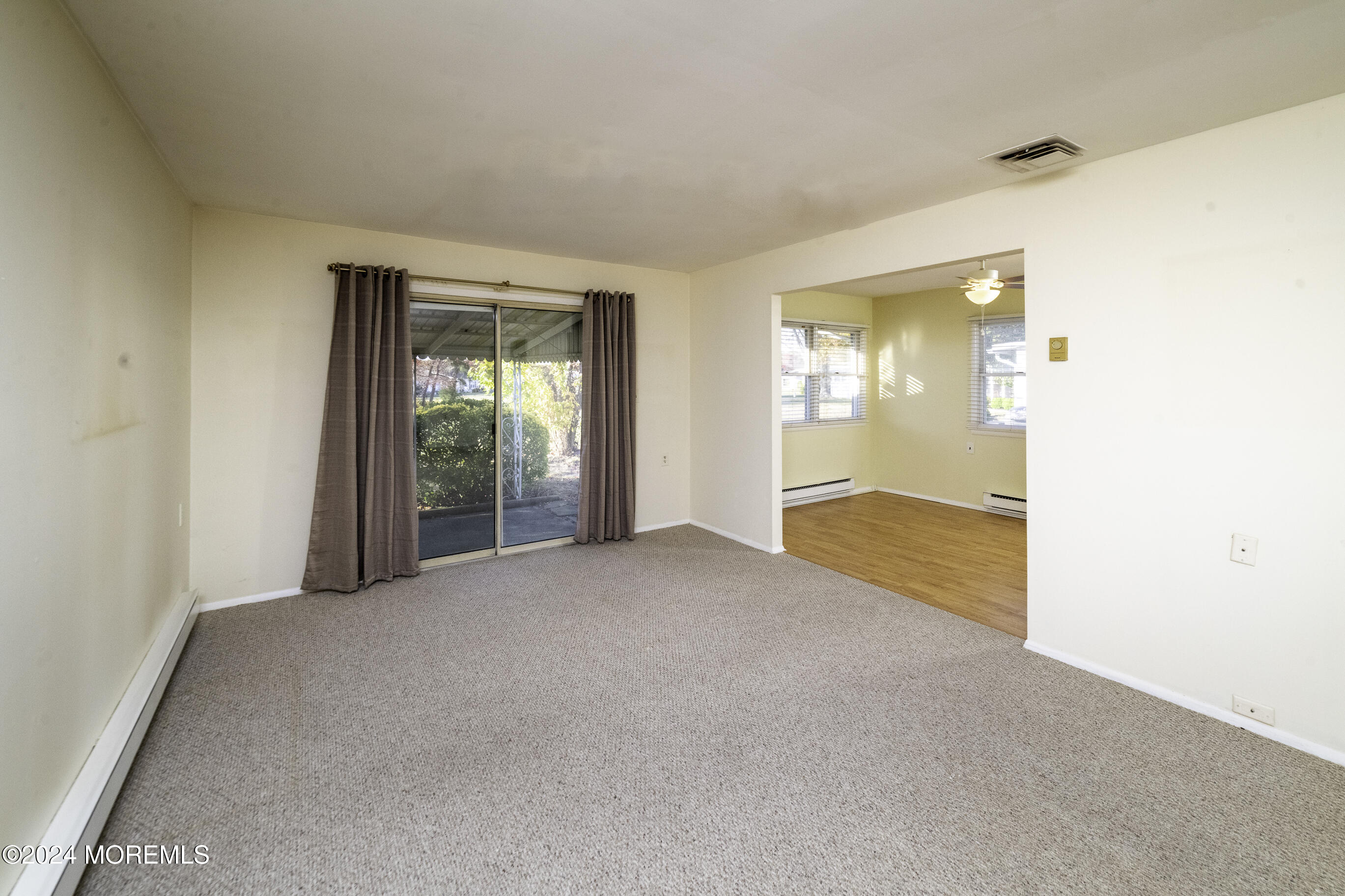 16 Lamb Road Brick, NJ 08724 - Photo 6 of 23 a view of an empty room with wooden floor and a window