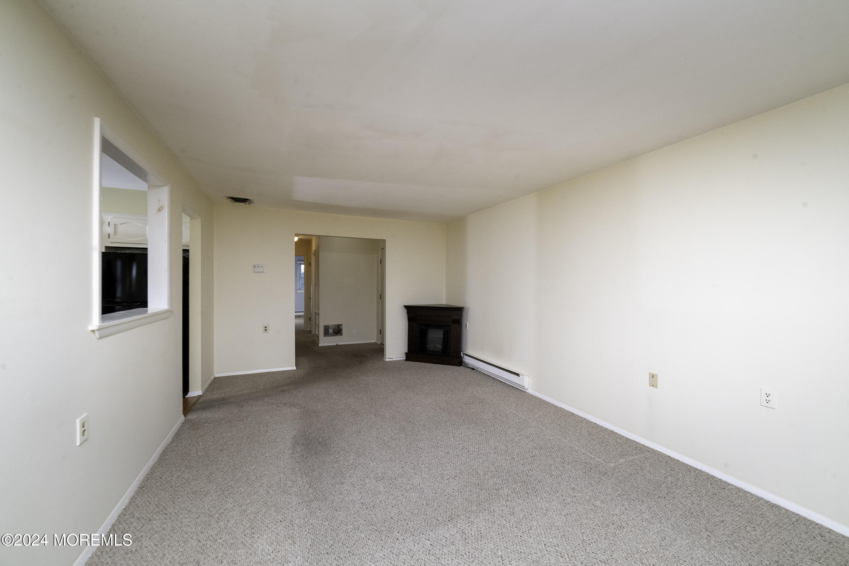 16 Lamb Road Brick, NJ 08724 - Photo 8 of 23 a view of a livingroom with an empty room and fire place