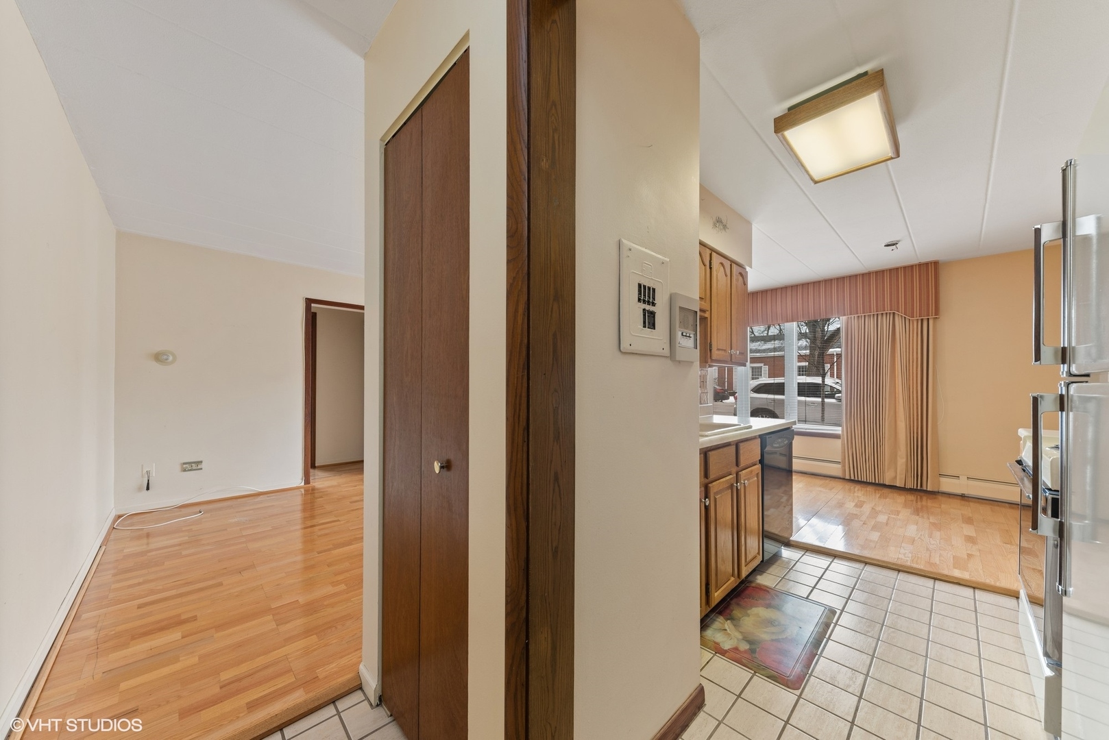 701 Busse Highway, Unit 1A Park Ridge, IL 60068 - Photo 3 of 15 a view of a kitchen with refrigerator and cabinets