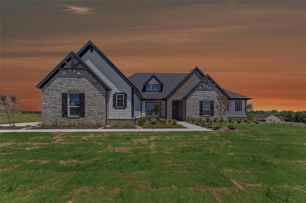 Expansive single-story residence with a stone and siding exterior
