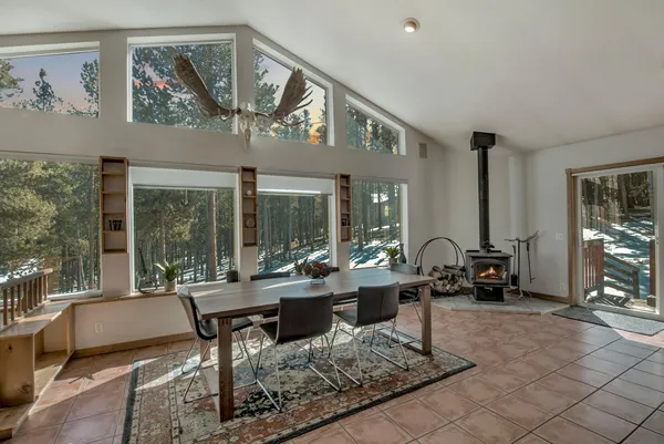 a living room with furniture and large windows
