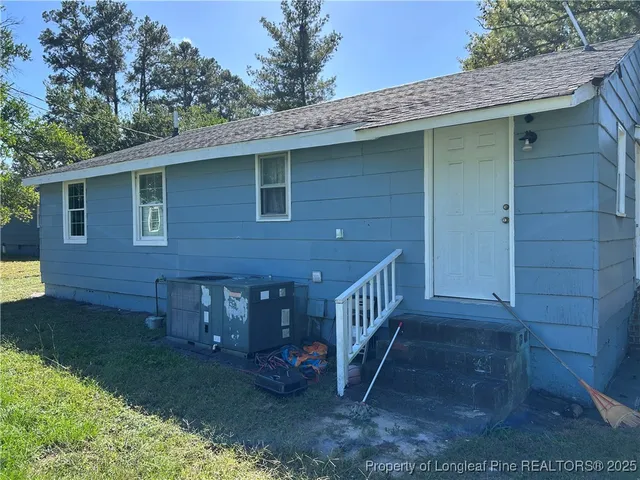 a room with a bed and a window