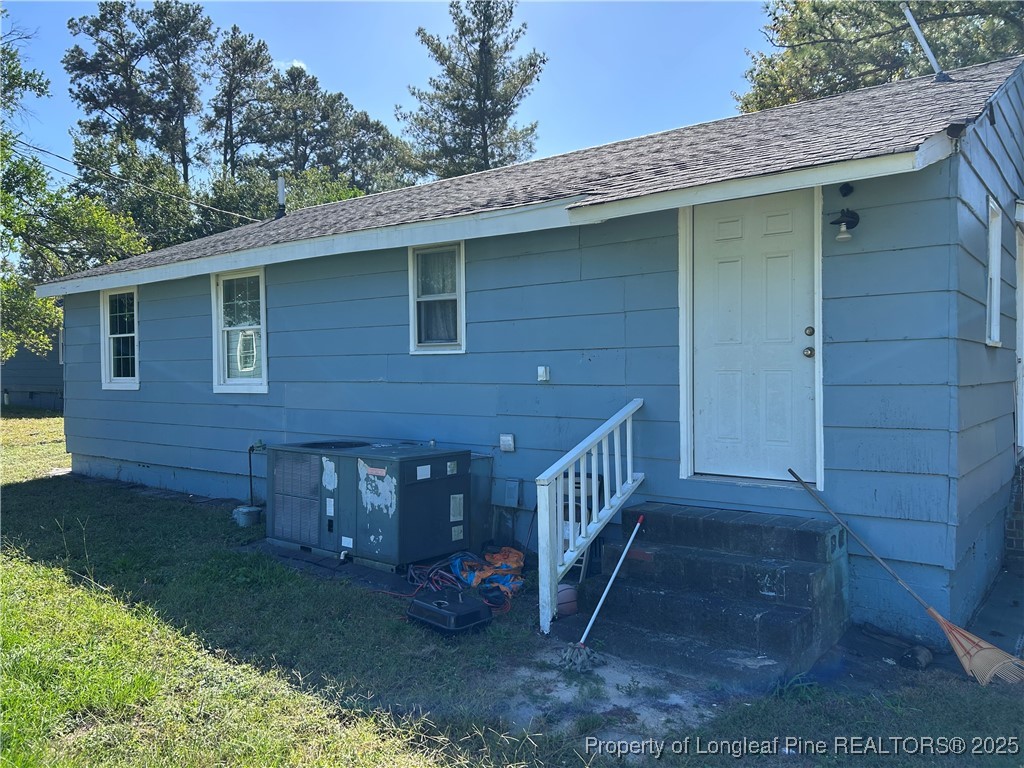 1600 Easterling Drive Spring Lake, NC 28390 - Photo 16 of 21 a view of a house with a yard and deck