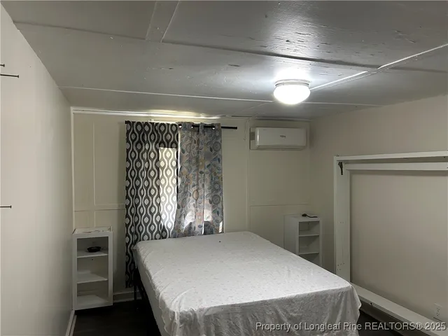 a bathroom with a shower and a sink