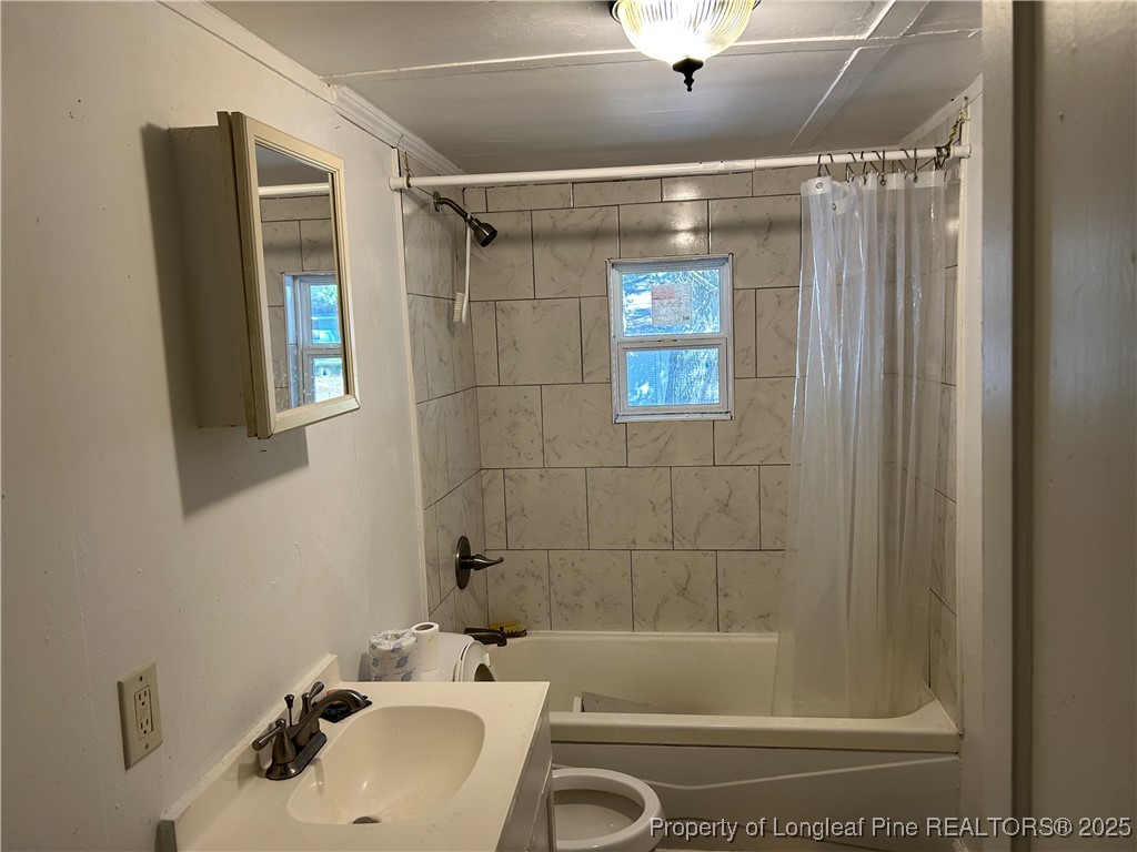 1600 Easterling Drive Spring Lake, NC 28390 - Photo 18 of 21 a bathroom with a shower and a sink