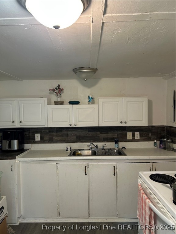 1600 Easterling Drive Spring Lake, NC 28390 - Photo 19 of 21 a kitchen with stainless steel appliances granite countertop a sink a stove and white cabinets