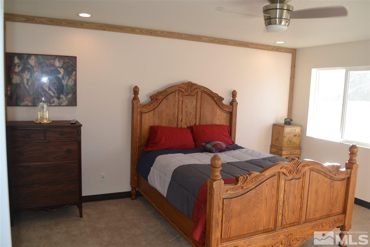 1100 McLean Road Fallon, NV 89406 - Photo 6 of 9 a bedroom with a bed and a dresser
