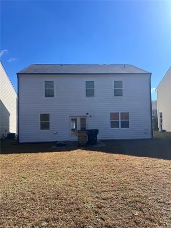 a view of a backyard of the house