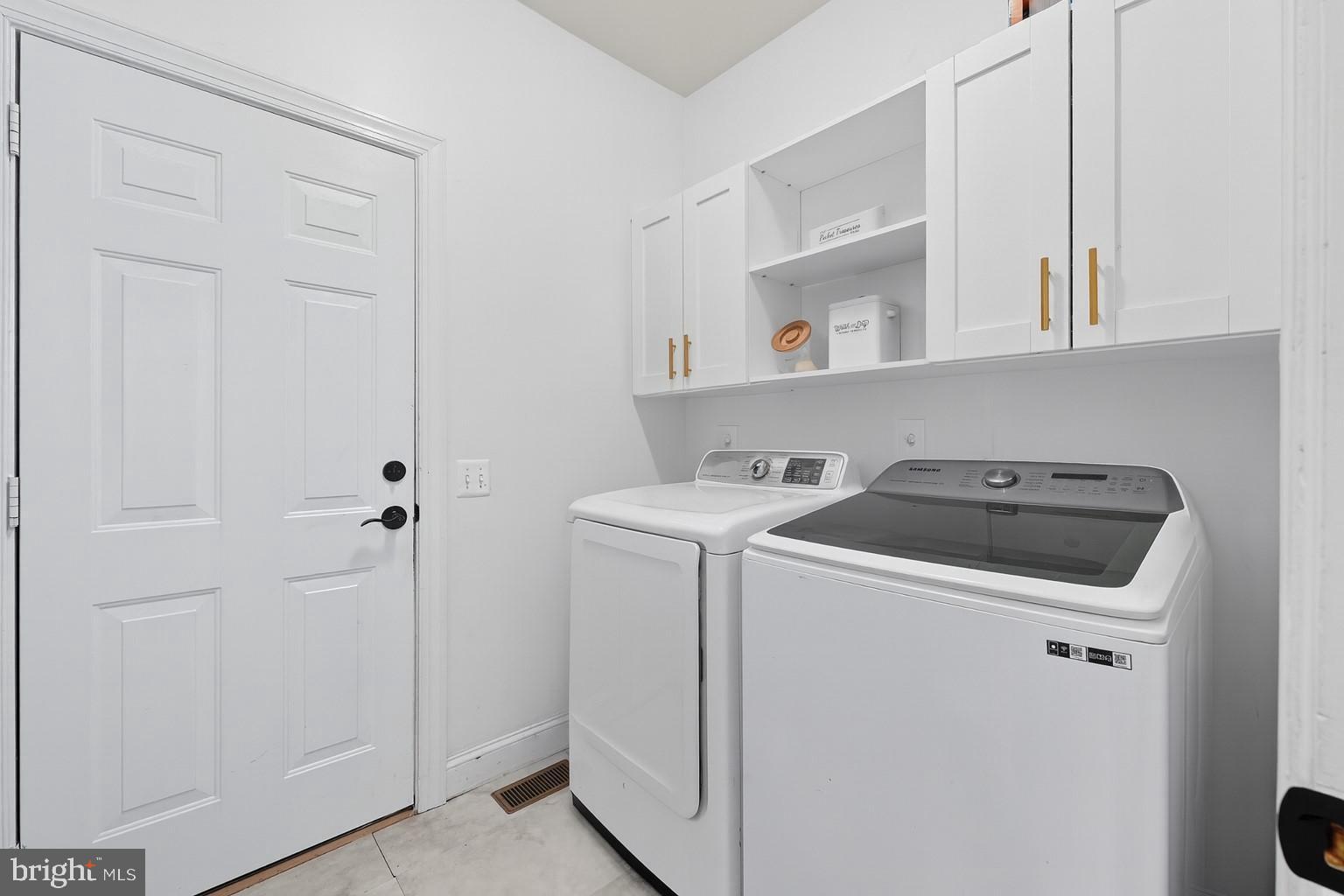 2725 Robaleed Way Herndon, VA 20171 - Photo 16 of 45 a utility room with dryer and washer