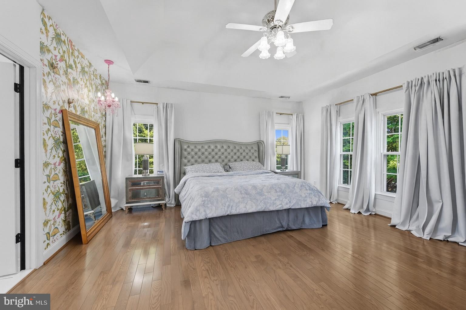 2725 Robaleed Way Herndon, VA 20171 - Photo 18 of 45 a bedroom with a bed next to a large window with the outer view