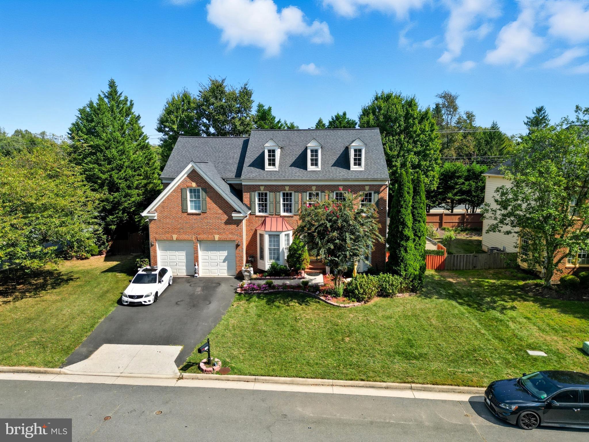 2725 Robaleed Way Herndon, VA 20171 - Photo 2 of 45 a front view of a house with a yard