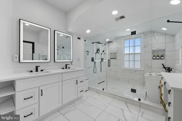 a bathroom with a shower sink and mirror