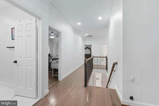 a view of entryway with wooden floor
