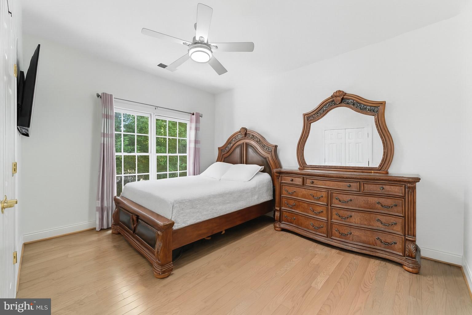 2725 Robaleed Way Herndon, VA 20171 - Photo 26 of 45 a bedroom with a bed dresser and a window