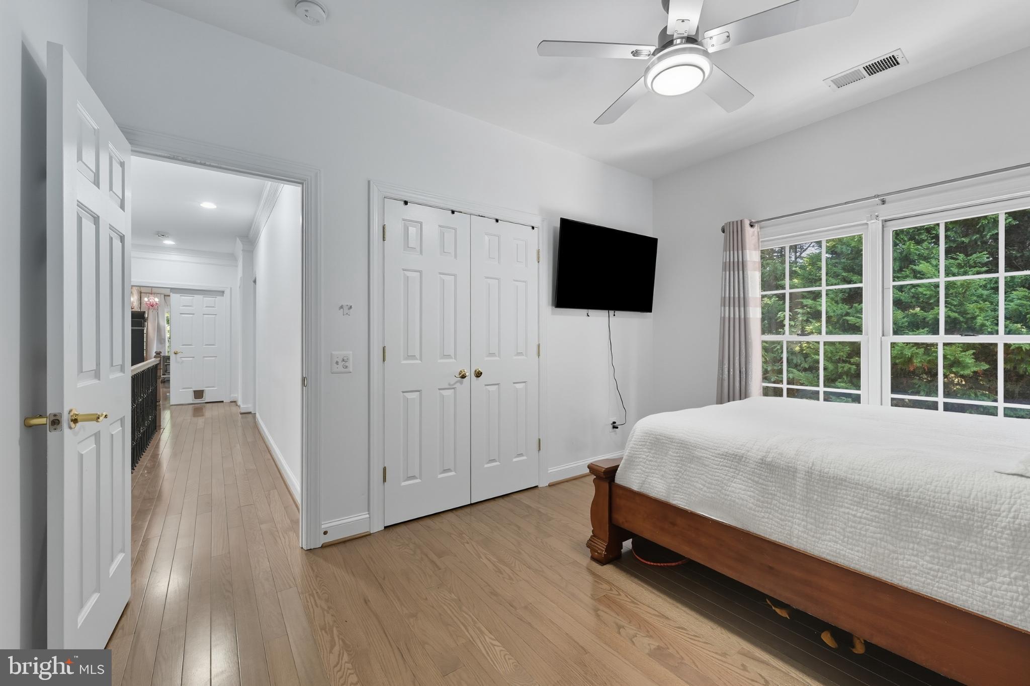 2725 Robaleed Way Herndon, VA 20171 - Photo 27 of 45 a bedroom with a bed and a flat screen tv