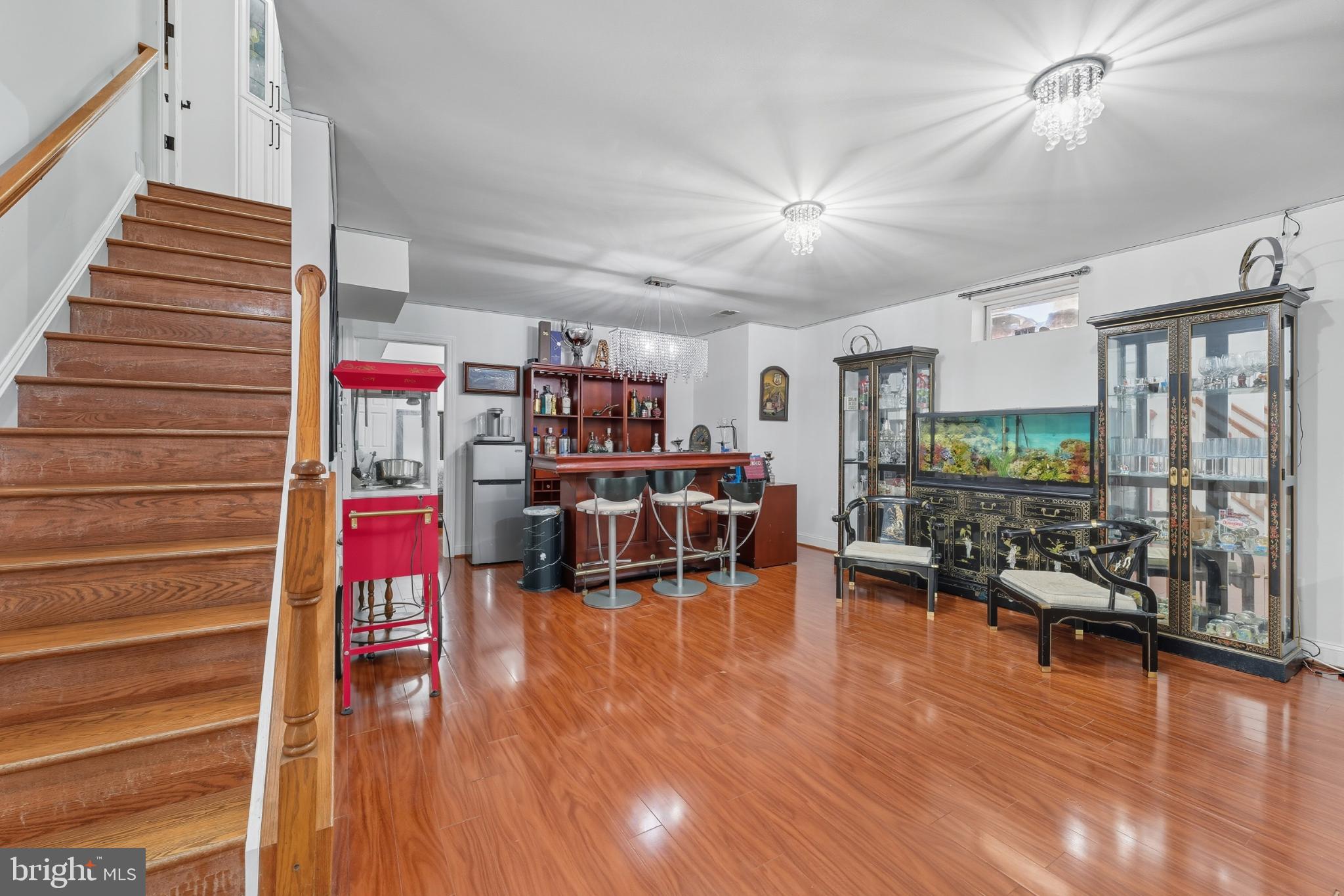 2725 Robaleed Way Herndon, VA 20171 - Photo 30 of 45 a living room with furniture and a wooden floor