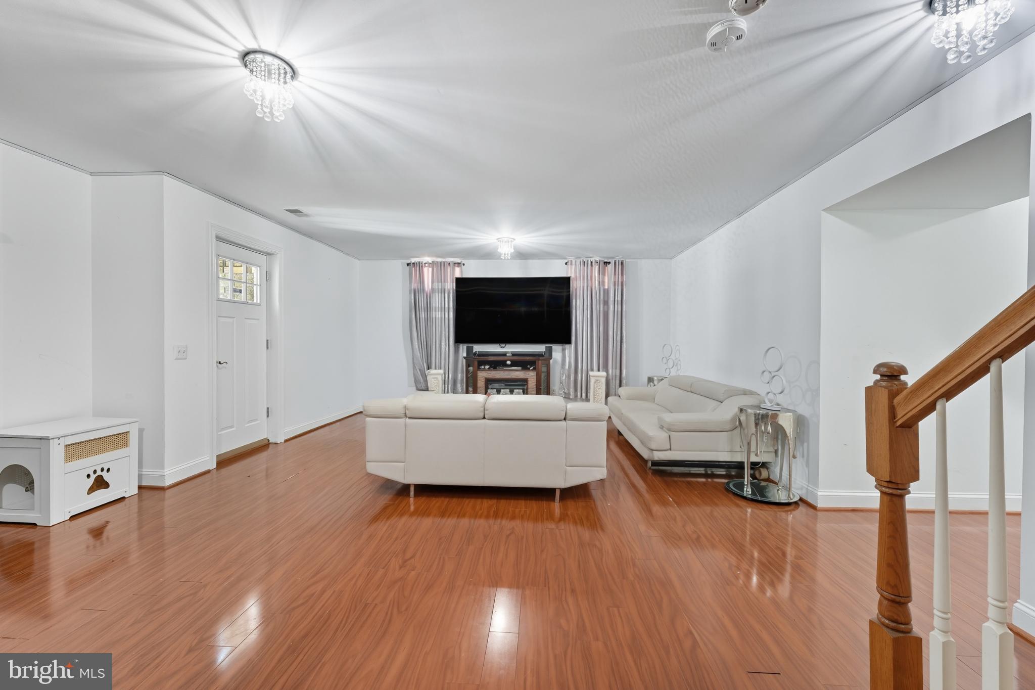 2725 Robaleed Way Herndon, VA 20171 - Photo 31 of 45 a living room with furniture and a flat screen tv