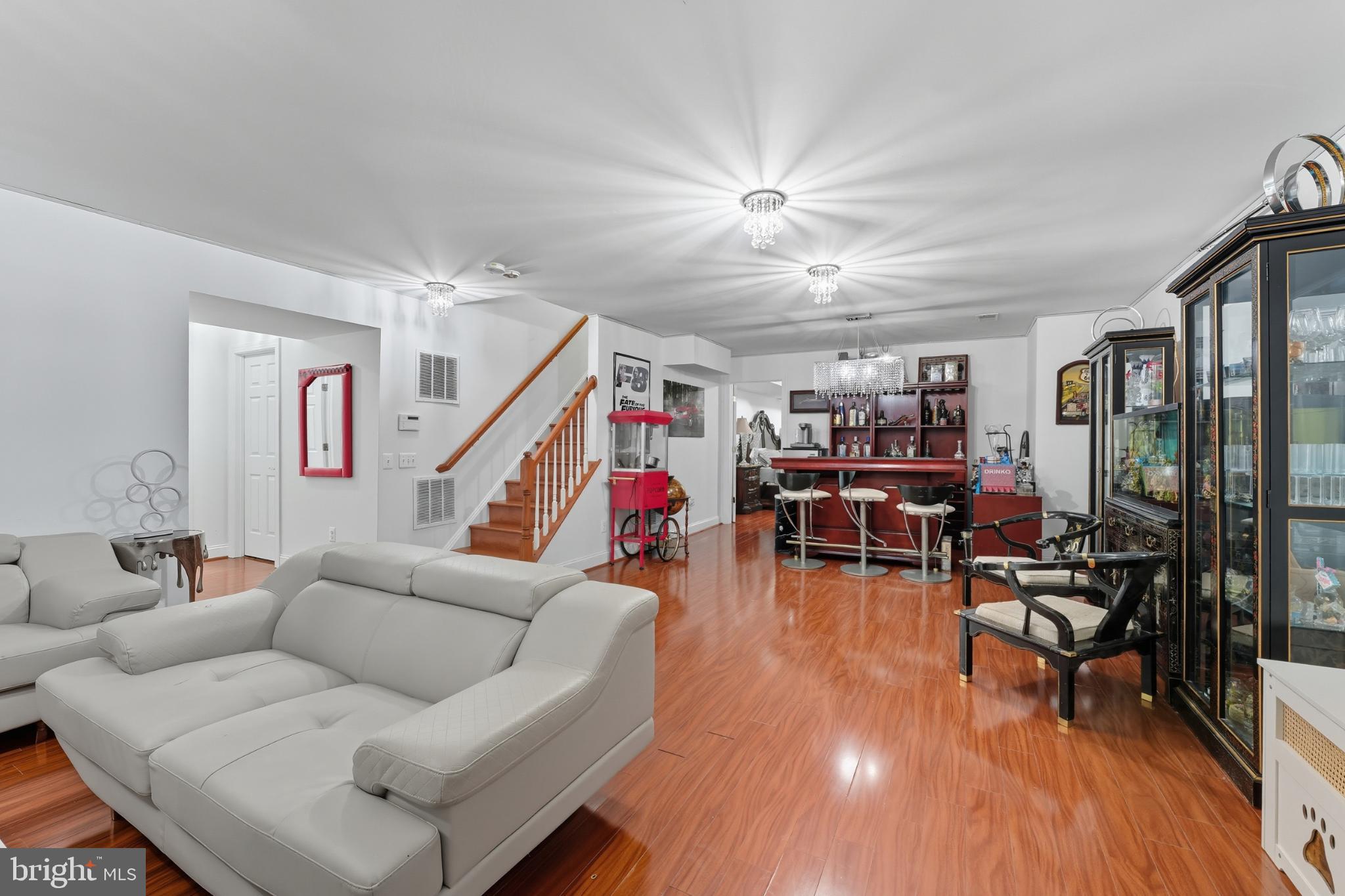 2725 Robaleed Way Herndon, VA 20171 - Photo 32 of 45 a living room with furniture and wooden floor