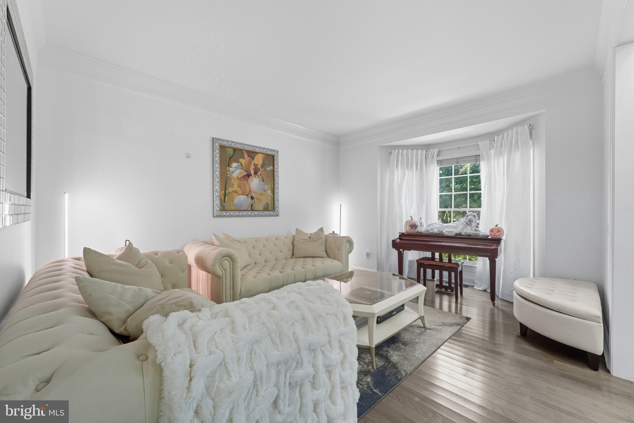 2725 Robaleed Way Herndon, VA 20171 - Photo 4 of 45 a living room with furniture and a window