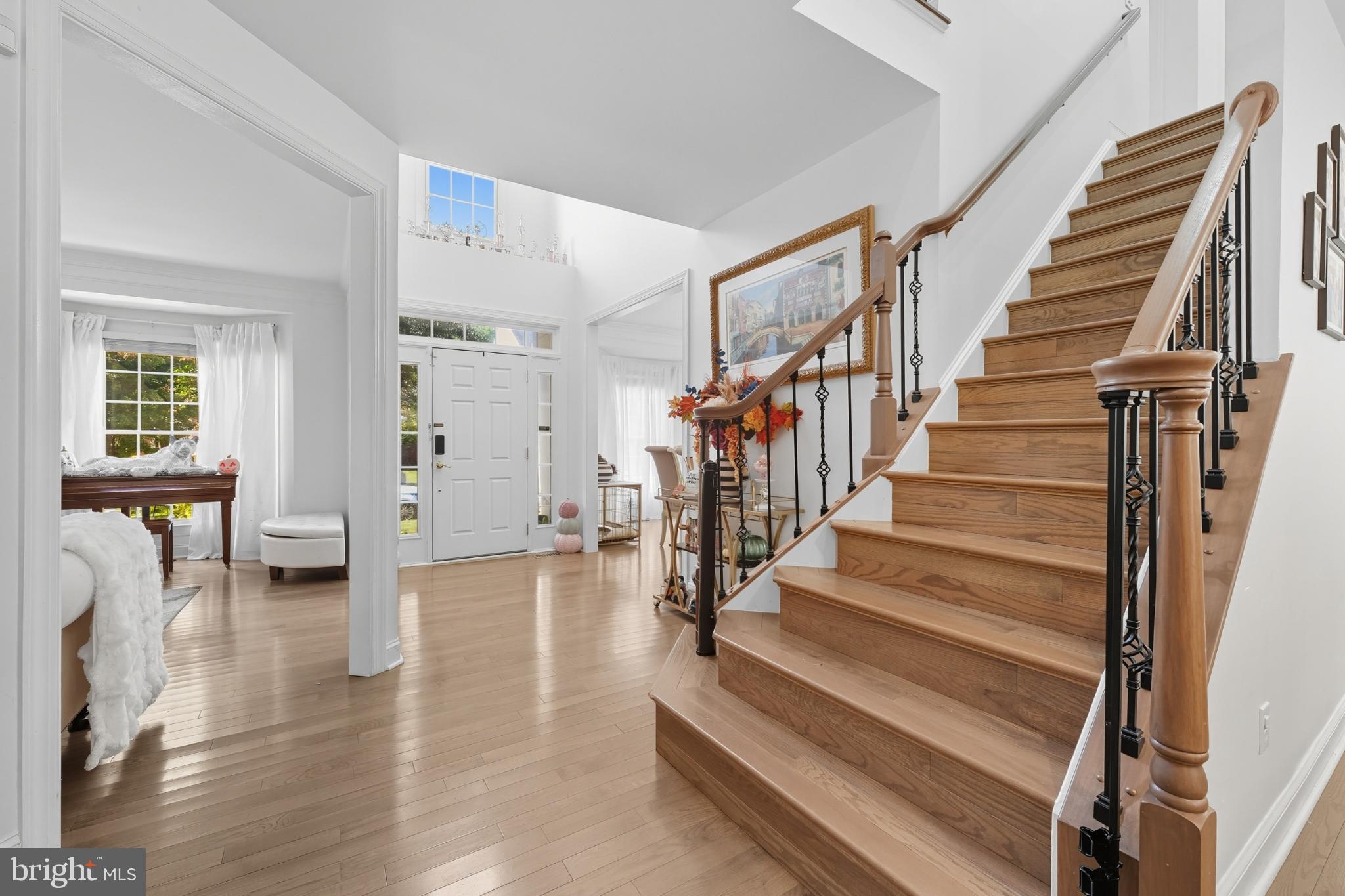 2725 Robaleed Way Herndon, VA 20171 - Photo 7 of 45 a view of staircase with lots of frames on wall and windows