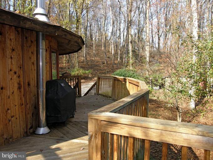 300 Farmington Road West Accokeek, MD 20607 - Photo 5 of 22 a view of roof deck with wooden floor and seating space