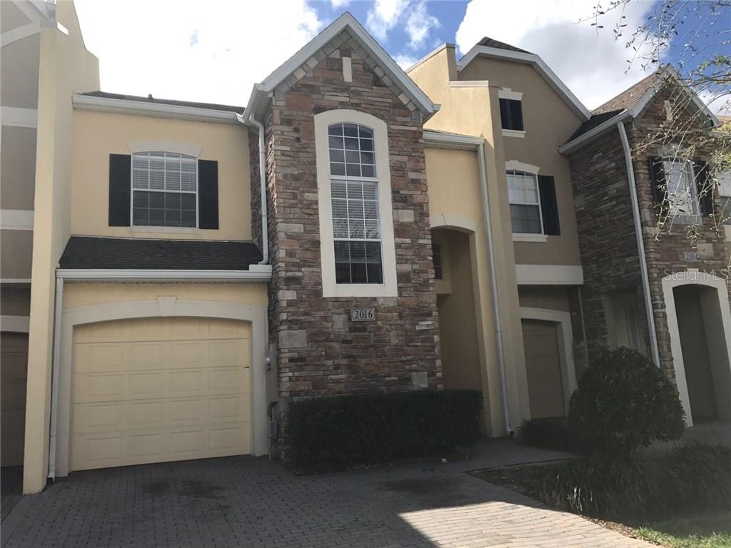 2016 Gold Spring Cove Kissimmee, FL 34743 - Photo 1 of 1 a front view of a house with a garage